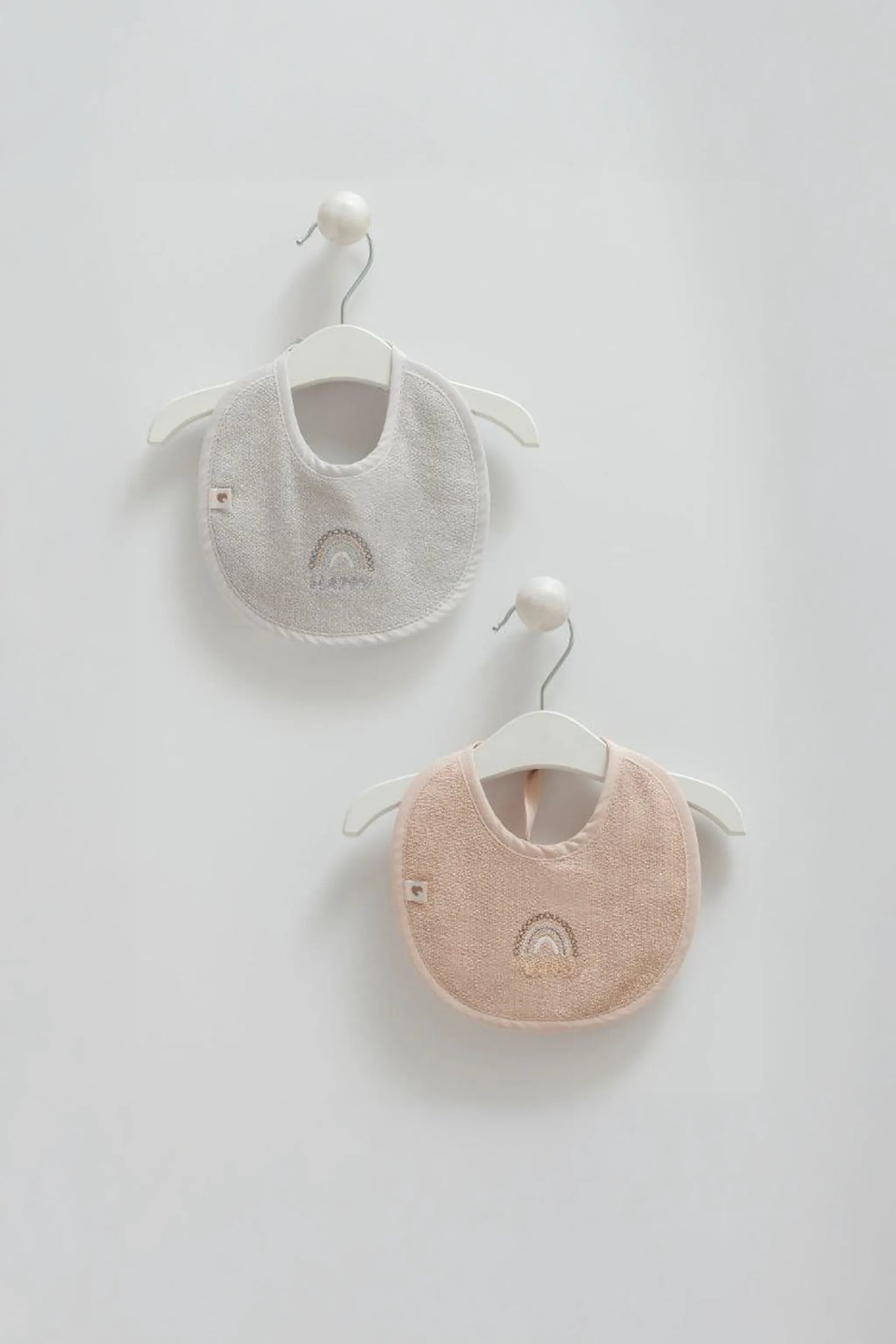 RAINBOW EMBROIDERED TOWEL BIB IN NAVY, BROWN AND GREY